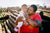 A Mother smiling while Holding Her Baby